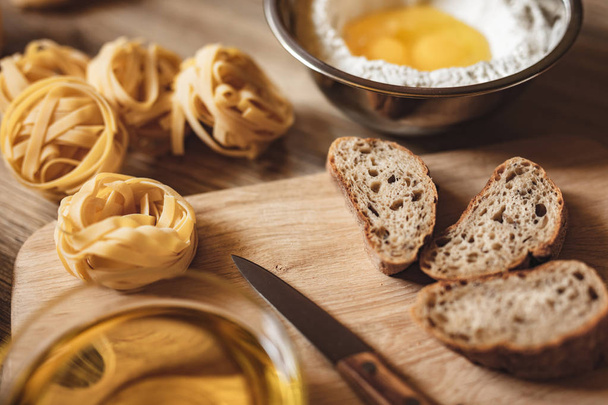 preparation recipe bread, pizza, spaghetti making ingridients, food flat lay on kitchen table background. - Foto, afbeelding