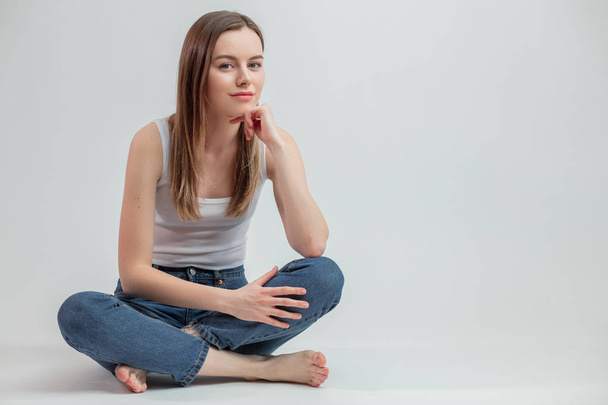 close-up photo of female teenager sitting and leaning on her hand - Foto, Imagen