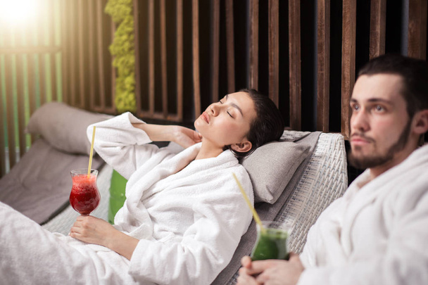 nice meditating woman and pensive pleasant guy in the spa resort - Foto, Bild