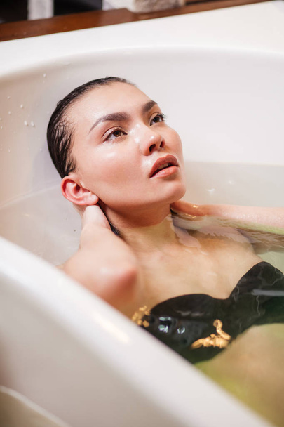 close up portrait of Asian girl in bath treatment - 写真・画像