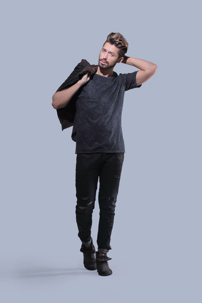 Portrait of a trendy bearded man on a gray background - Photo, image