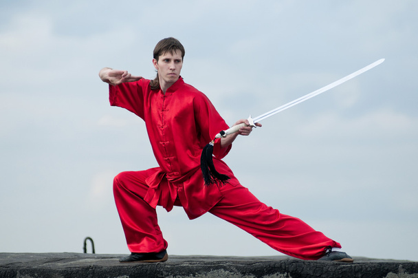 Wushoo man in red practice martial art - Foto, Imagen