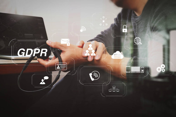 GDPR. Data Protection Regulation with Cyber security and privacy virtual diagram.Man using VOIP headset with digital tablet computer docking smart keyboard, concept communication, it support. - Photo, Image