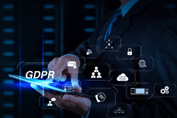 GDPR. Data Protection Regulation with Cyber security and privacy virtual diagram.businessman hand using tablet computer and server room background - Foto, afbeelding