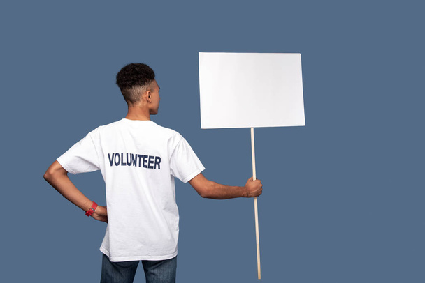 Pleasant young man being a volunteer - Photo, image