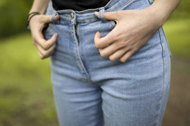 Womens hips in denim at outdoors - Photo, Image