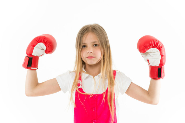 Cute boxer. Girl on dreamy calm face posing with boxing gloves, isolated white background. Kid long hair dreaming to be strong and independent. Independence concept. Child dreams power and victory - Photo, Image