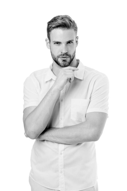 Let me think. Man with bristle serious face, white background. Guy bearded thoughtful touches bristle on chin. Thoughtful mood concept. Man with beard or unshaven guy looks handsome formal wear - Valokuva, kuva