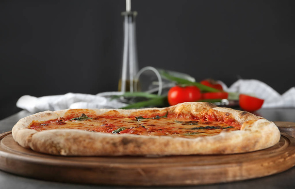 Tasty pizza on table. Fresh from oven - Photo, image