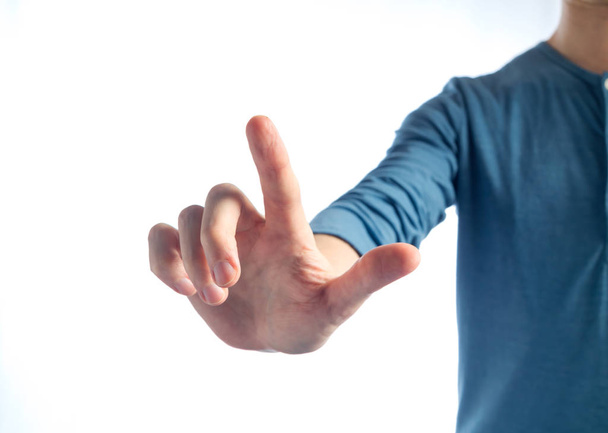 Man in pointing or pressing something - Фото, изображение