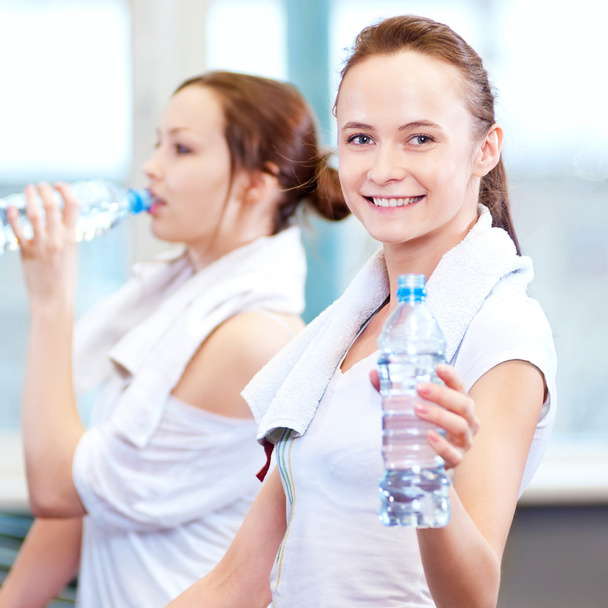 Women drinking water after sports - Foto, immagini