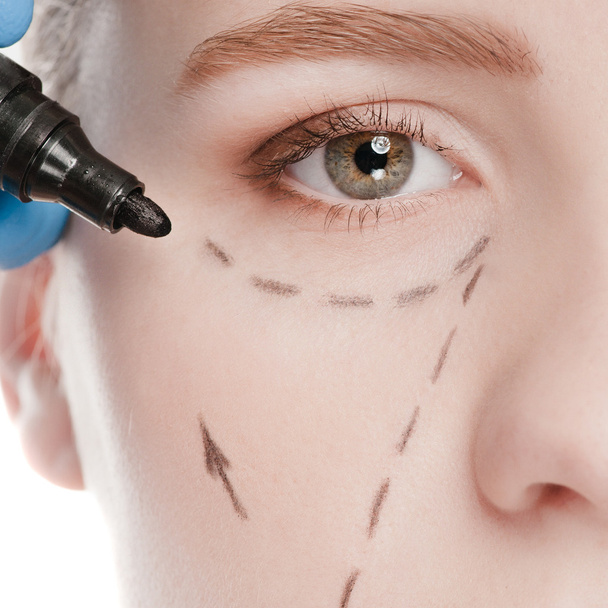 Beautician draw correction lines on woman face - Photo, Image