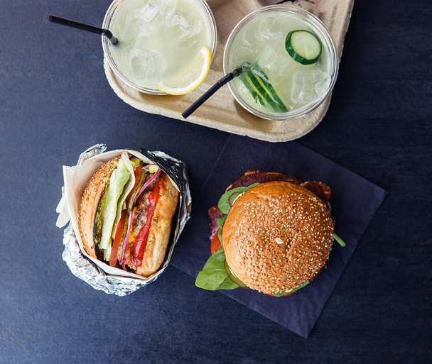 Two beverages and two fastfood burgers - Fotoğraf, Görsel