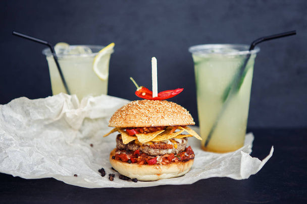 Two beverages and one mexican burger - Фото, изображение