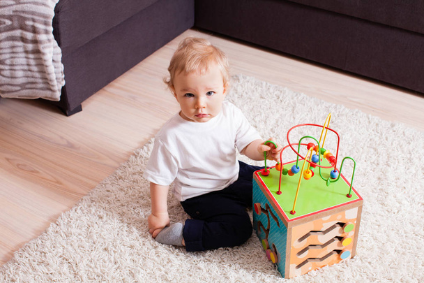 smart boy wants to play with very interesting toy - Foto, imagen