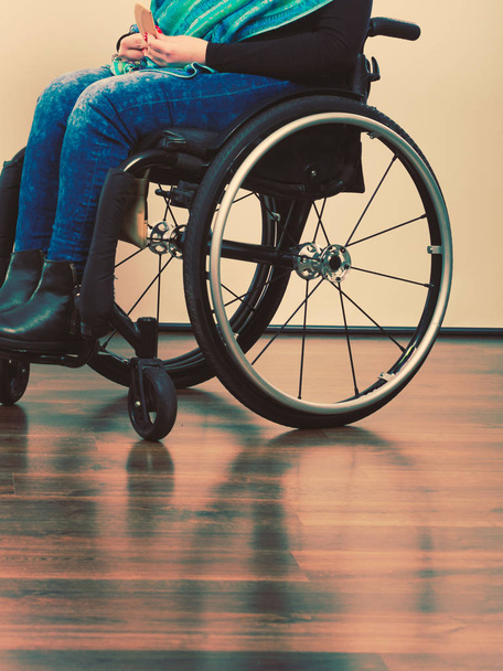 Disease disability paralysis handicap health concept. Legs of disabled person. Crippled female sitting on wheelchair. - Φωτογραφία, εικόνα