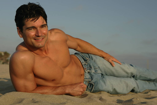 the handsome man poses in the beach. - Photo, Image