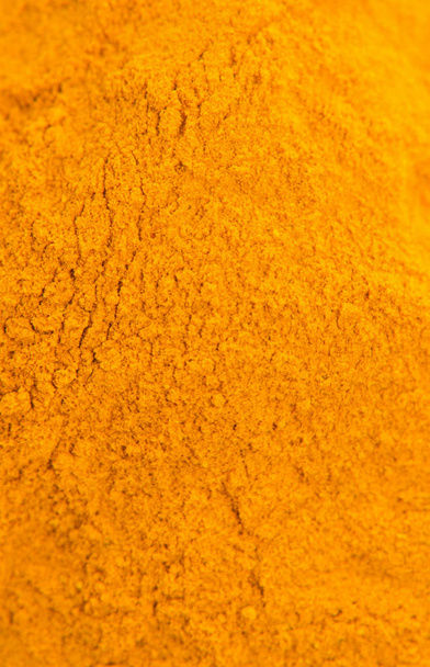View from the top of dried turmeric. Macro background. - Photo, Image