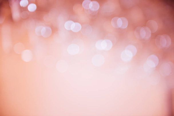 Stylish light pink background. Blurred glasses with bokeh - 写真・画像