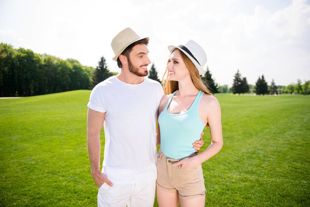 Portrait of lovely romantic couple, handsome man beautiful woman embracing looking at each other enjoying leisure free time outdoor. Tranquility rural concept - Foto, immagini