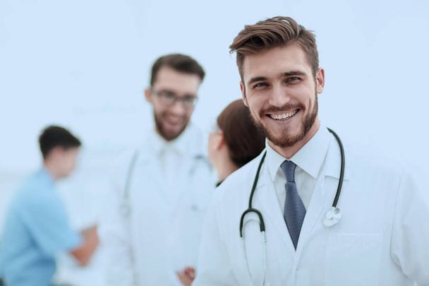 Portrait of friendly male doctor smiling - Foto, afbeelding