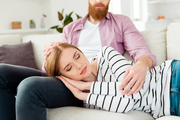 Red hair bearded hipster happiness serenity purity beauty quiet pleasure enjoy joy tranquil partner concept. Close up portrait of charming cute lovely sweet beautiful lady sleeping on husband's knees - Zdjęcie, obraz
