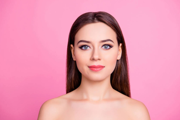 Portrait of pretty attractive smiling glad woman with excellent make up flawless pure skin naked shoulders straight silky smooth brown haircut, isolated on pink background, copy-space - Фото, изображение