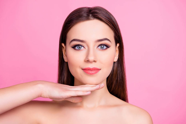 People wellness vitality concept. Close up portrait of beautiful charming ideal gorgeous sensitive fancy pure clear woman's skin, she is touching chic with palm, isolated on pink background - Foto, imagen
