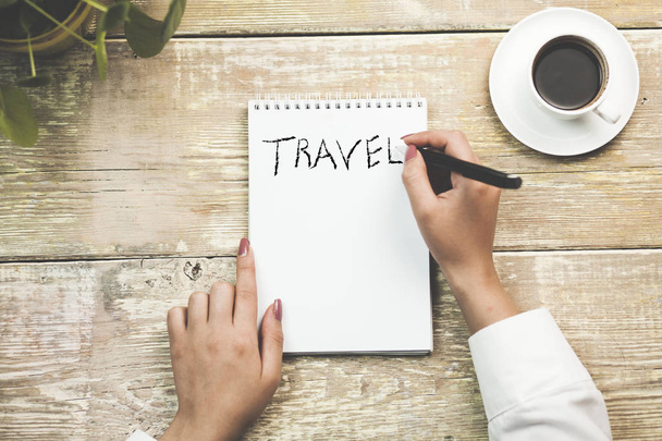 woman writing travel word on notebook - Photo, Image