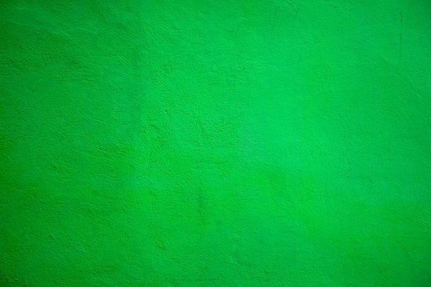 Close-up of a  green wall covered with plaster. Gray background - Photo, Image