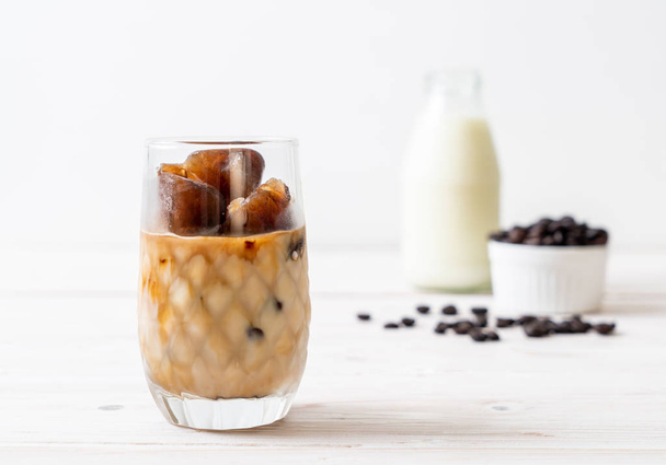 coffee ice cubes with milk on wood table - Foto, immagini