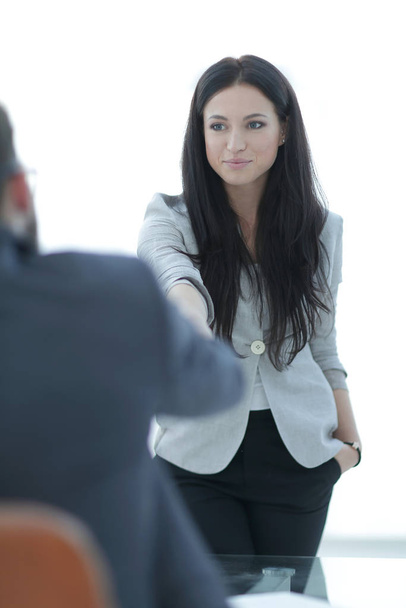 business woman welcomes colleague with handshake - Foto, imagen