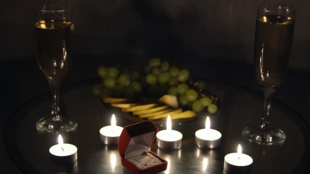 Romantic evening with candles with champagne and fruits. An offer of marriage - Felvétel, videó