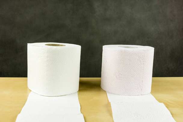 White and red roll of soft cellulose toilet paper. - Photo, Image