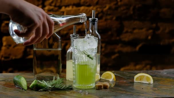 Preparation of green alcoholic cocktail. Slow motion shot - Кадри, відео