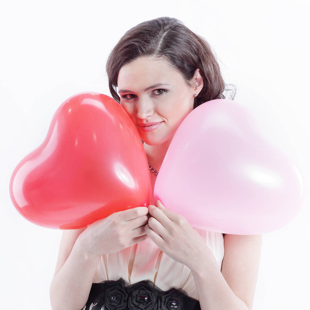 beautiful young woman holding red balloon heart. - Фото, зображення