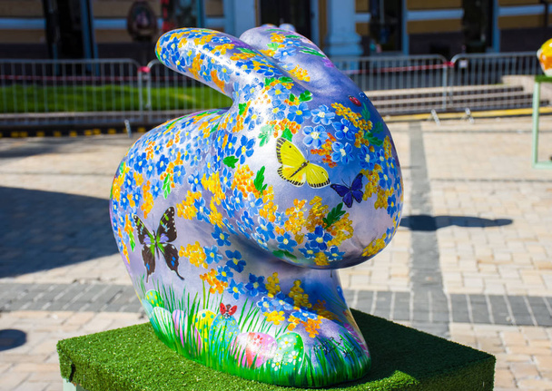 3D shape of Easter bunny or rabbit with painted multicolored flowers, butterflies and Easter eggs on it. Beautiful art decoration. Kyiv (Kiev), Ukraine, april 2018 - Fotó, kép