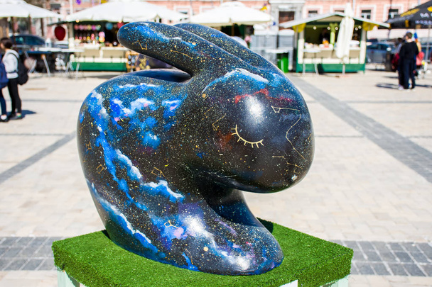 Volume artistic rabbit or hare statue, painted in space motifs. Beautiful art easter decoration - Fotó, kép