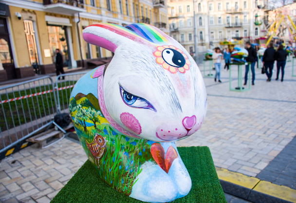 3D painted colorful art figure of easter bunny with eastern shape of eyes with Yin-Yang sign on his forehead. Beautiful art easter decoration .Kyiv (Kiev), Ukraine, april 2018 - Fotó, kép