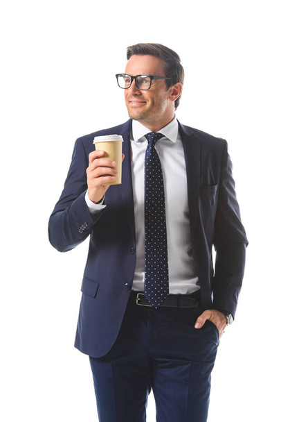 happy businessman in eyeglasses holding paper cup of coffee isolated on white background  - Foto, afbeelding