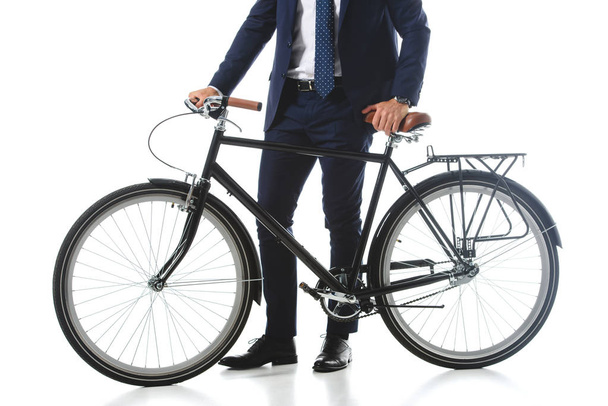 cropped image of businessman standing with bicycle isolated on white background  - Foto, Imagen