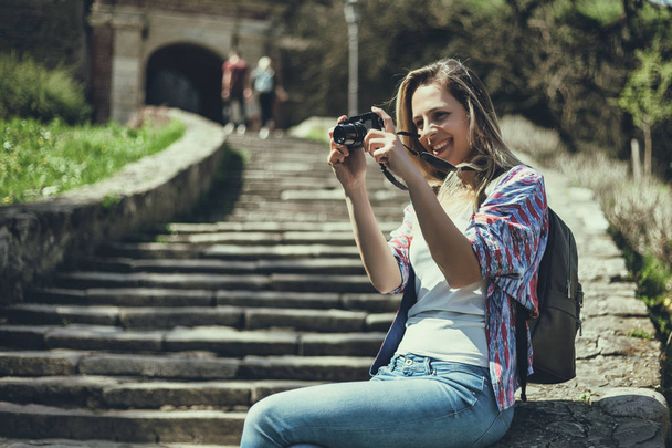 Happy tourist is photographing on sunny day.  - Valokuva, kuva