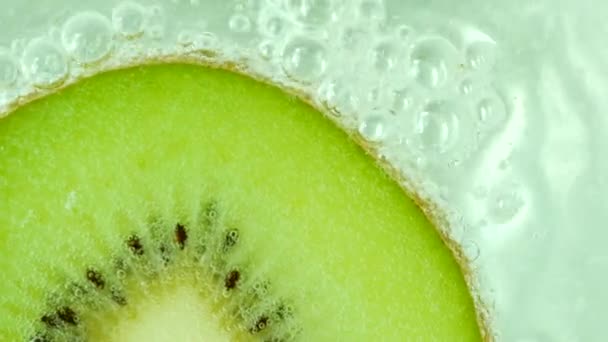 Macro of kiwi fruit in water - Footage, Video
