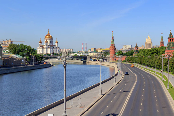 View of Kremlevskaya embankment and Cathedral of Christ the Saviour in Moscow on a sunny summer morning - Fotó, kép