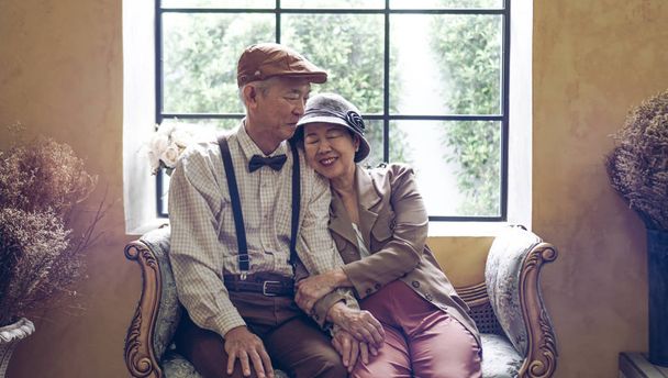 Asian senior couple dress vintage retro style in luxury house with tuscan style yellow wall - Zdjęcie, obraz