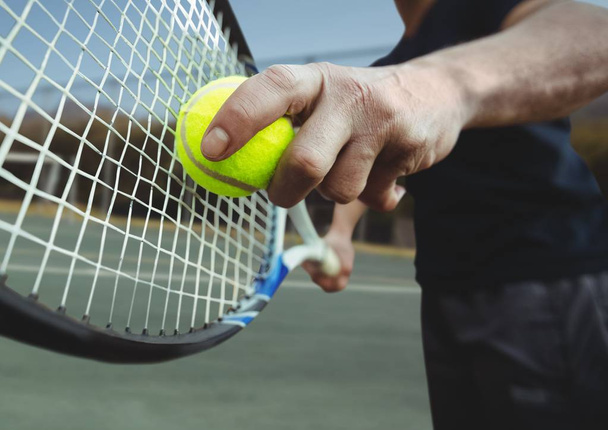 Digital composite of Tennis player holding racket on court with racket - Foto, Imagem