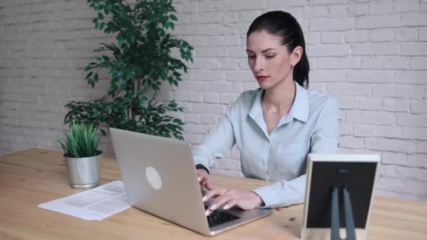 Business Woman Having Headache While Working Using Laptop Computer. Stressed And Depressed Girl Touching Her Head, Feeling Pain While Sitting At Wooden Table At Cafe. Work Failure Concept - Footage, Video