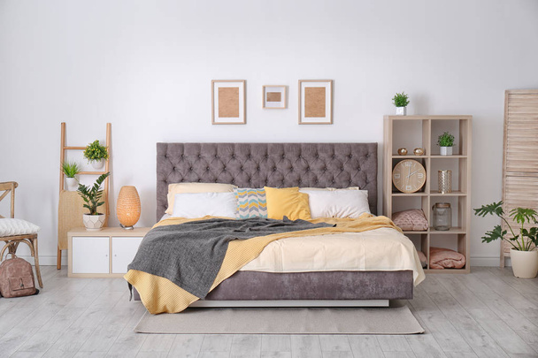 Bedroom interior with comfortable soft bed - Fotografie, Obrázek