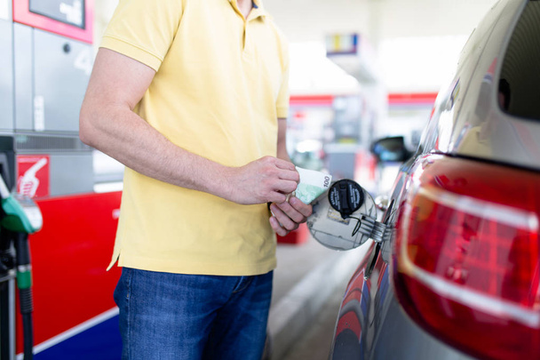 man filling gasoline fuel in car at gas station - Photo, Image
