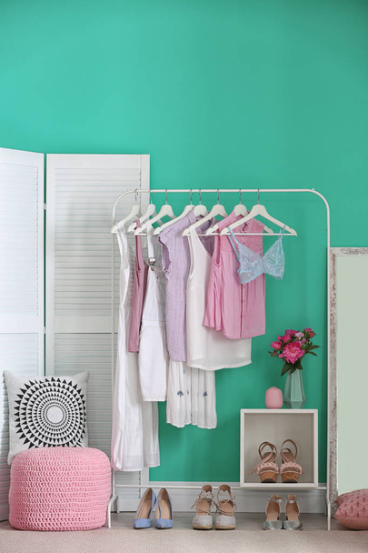 Stylish dressing room interior with clothes rack - Foto, imagen